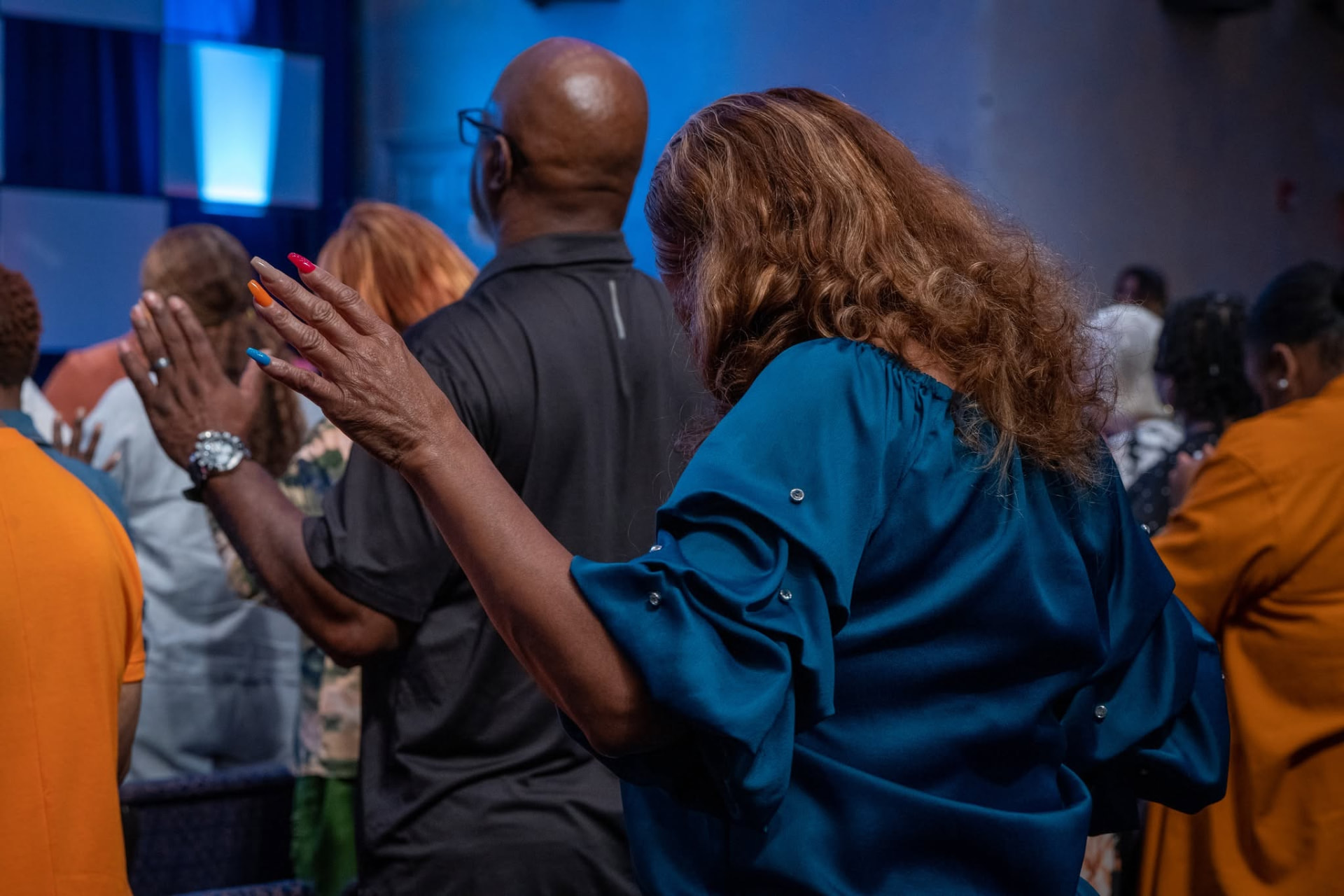 Worshipper with hand lifted in prayer